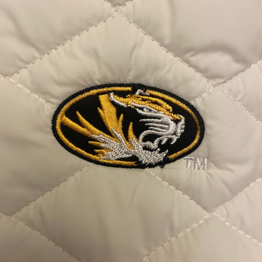 White TM Mizzou 100 % nylon vest. Never worn child went to a different college.